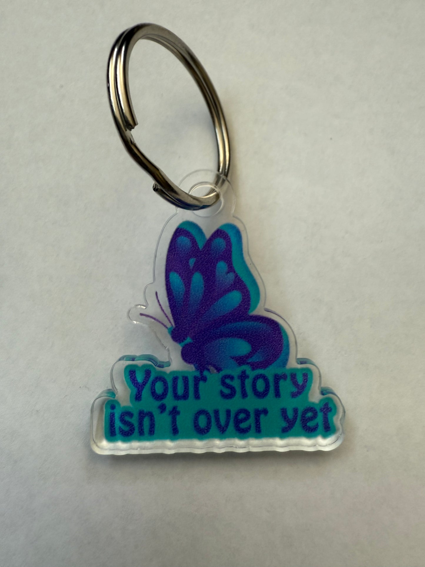 Your story isn’t over yet keychain