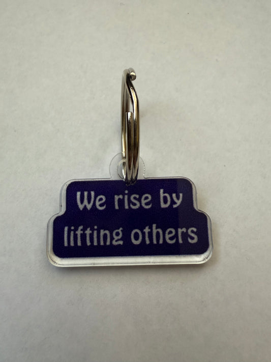 We rise by lifting others keychain