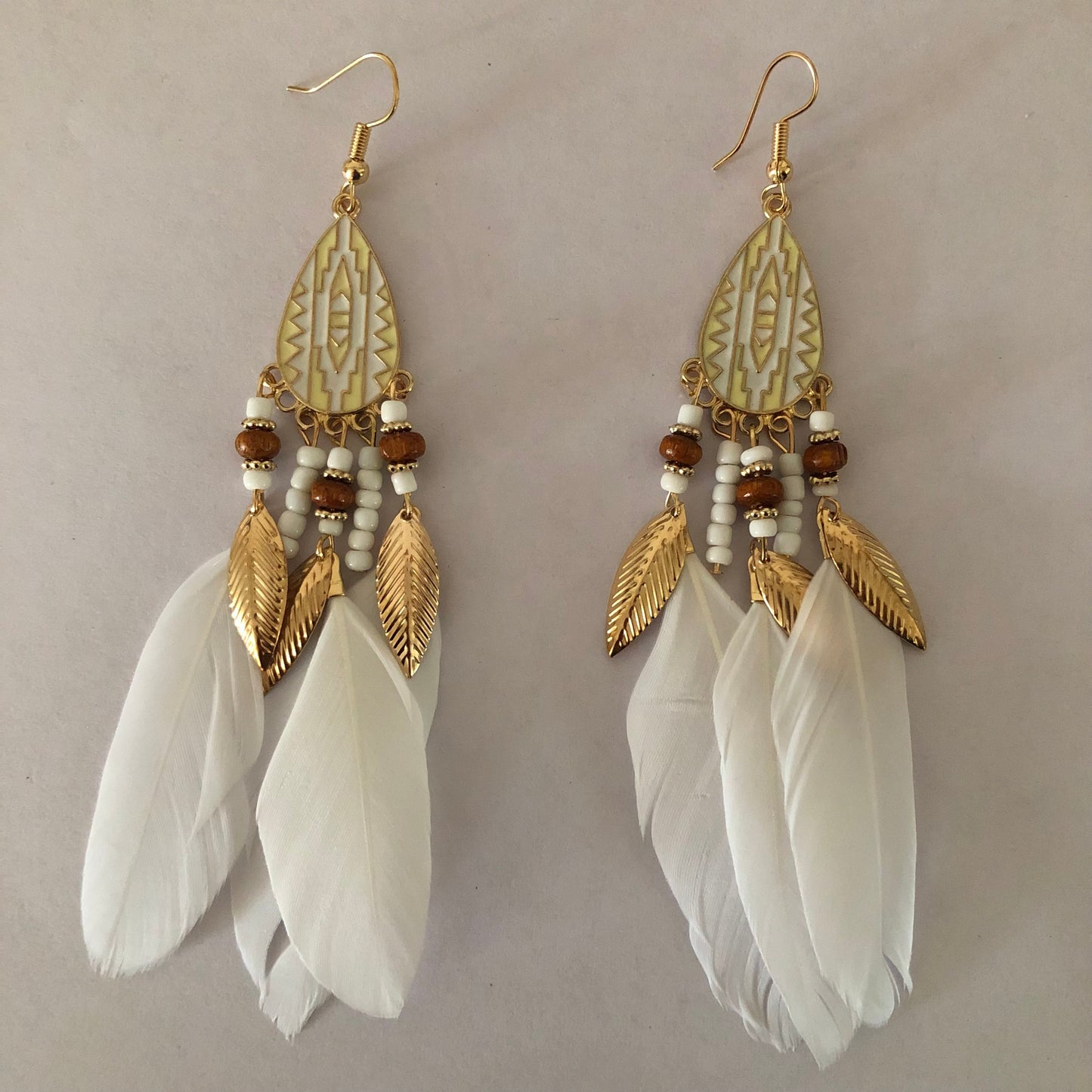 Drop dangle earrings with feathers