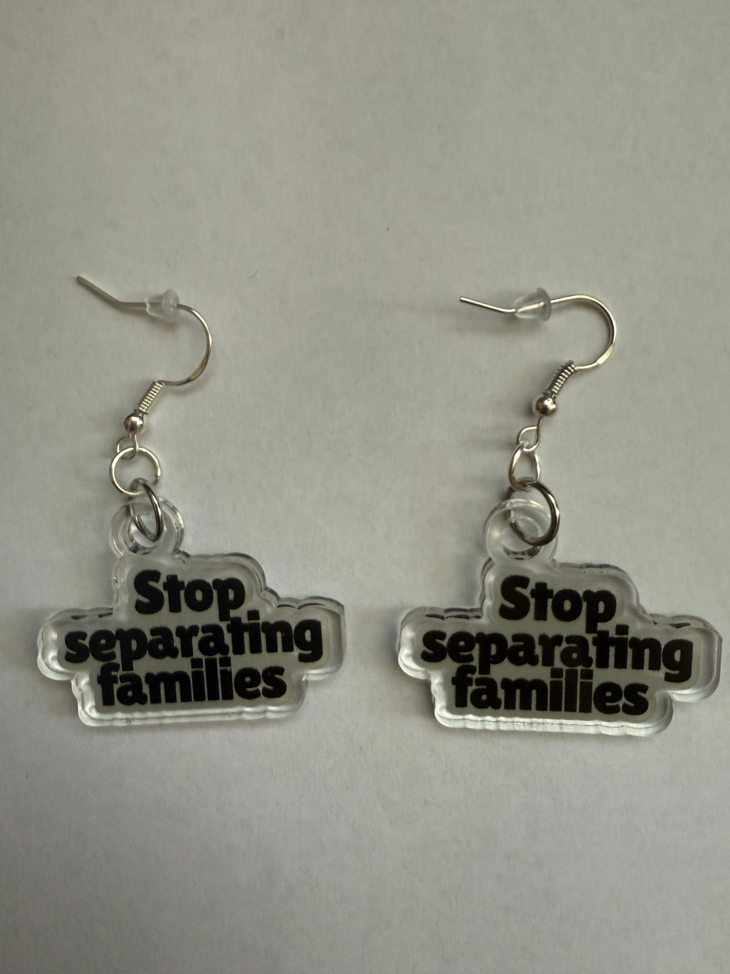 Stop separating families earrings